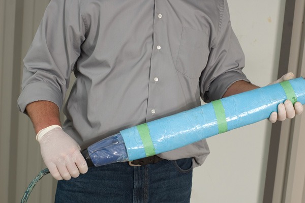Accurate leak tech holding trenchless epoxy pipelining in Fort Worth, TX.